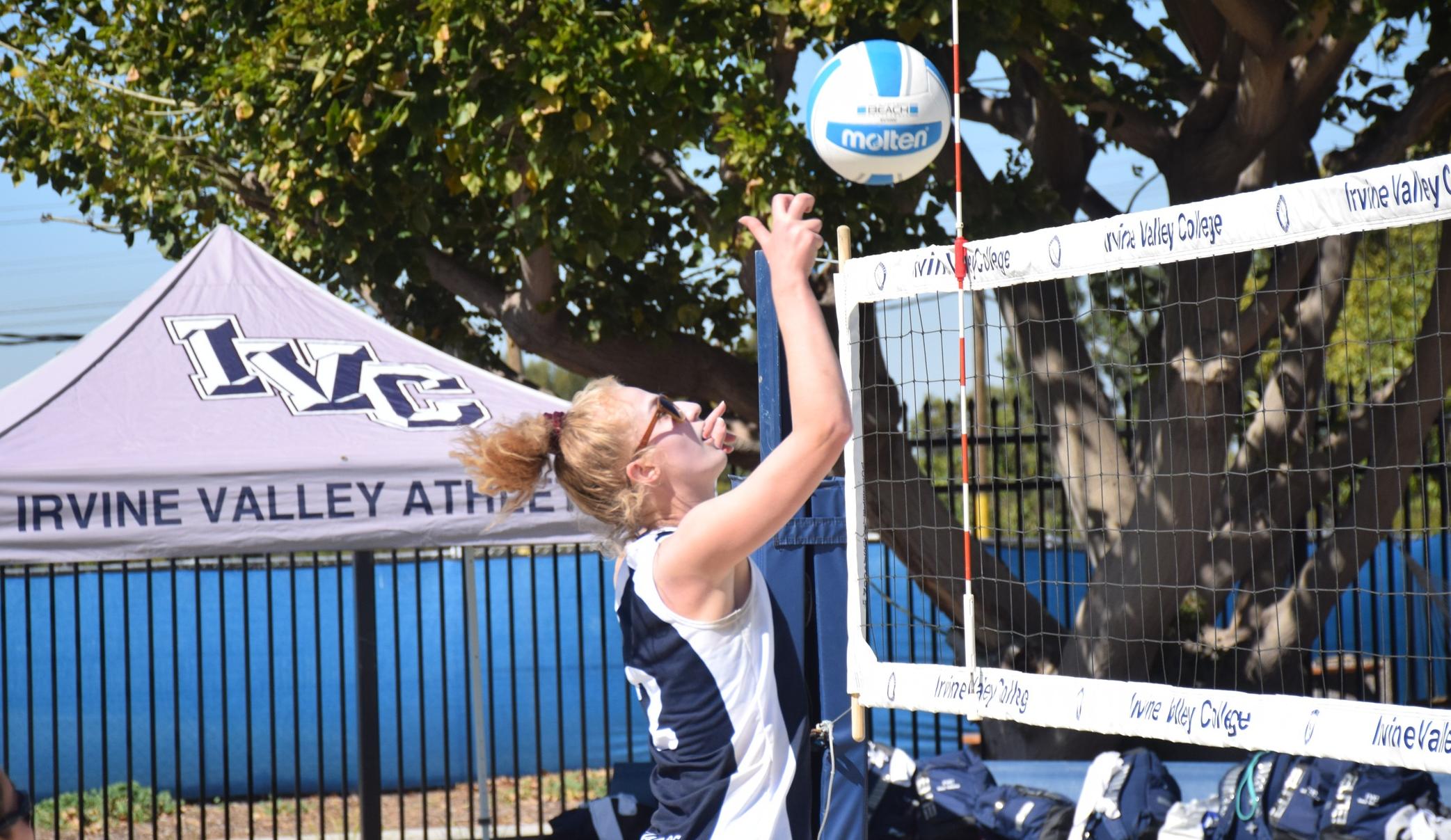 Beach volleyball team records Saturday morning split